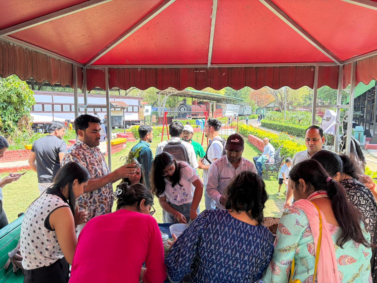Participants and families building terrariums together during the hands-on session