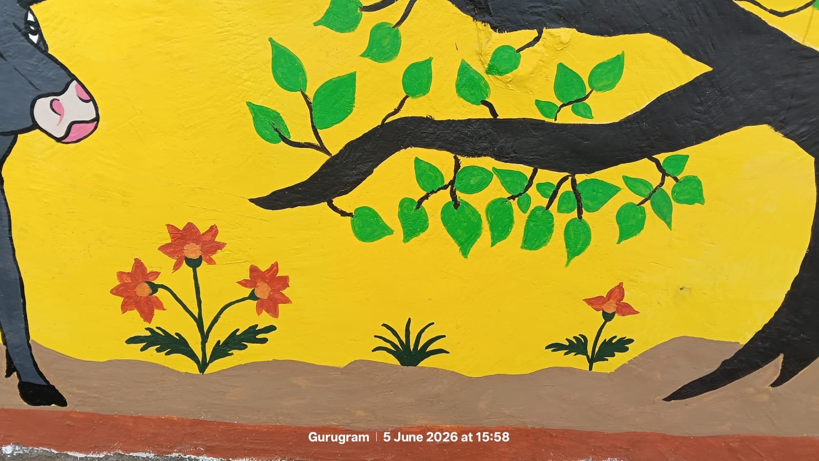Sacred tree and floral mural artwork on Gurugram wall